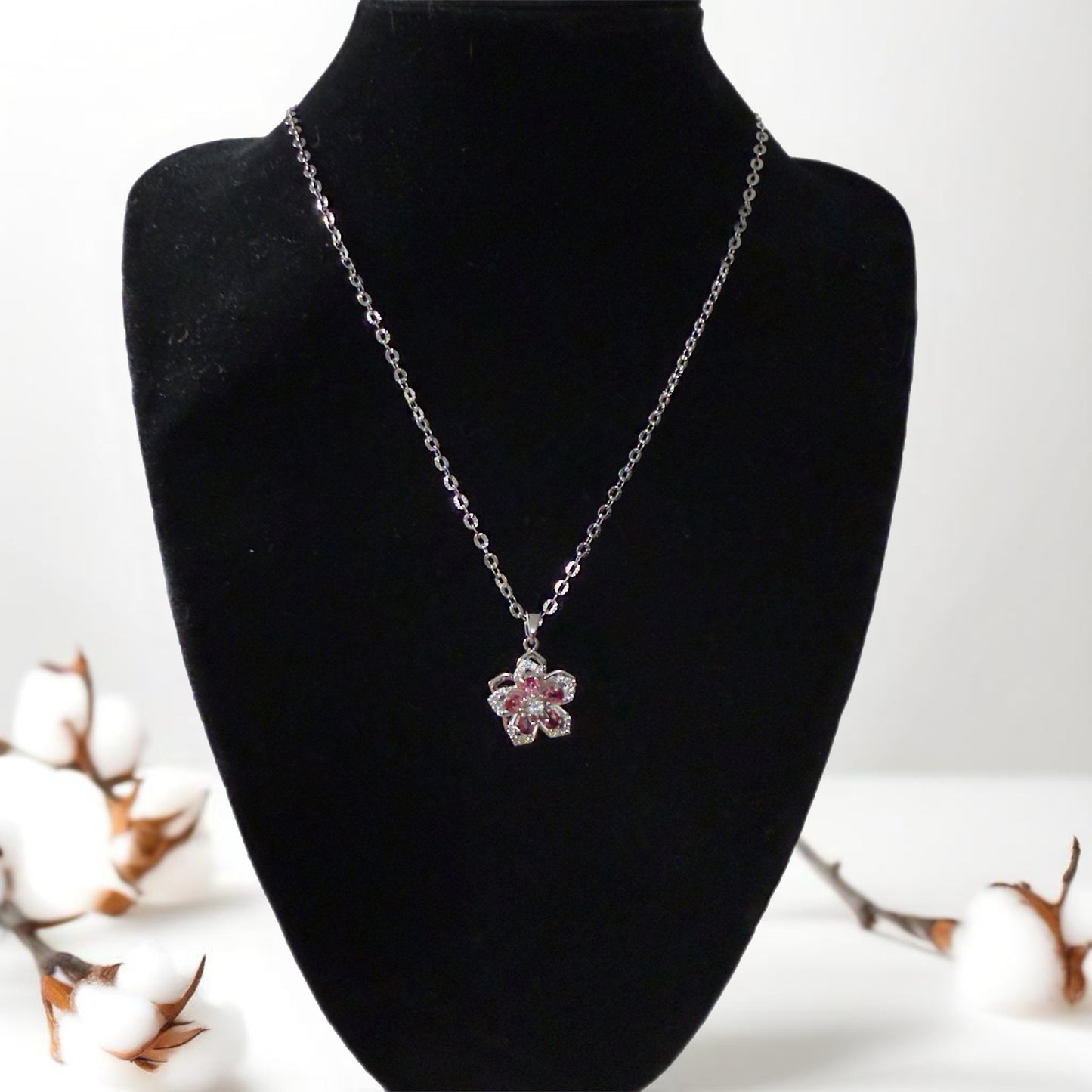 Silver flower pendant necklace.