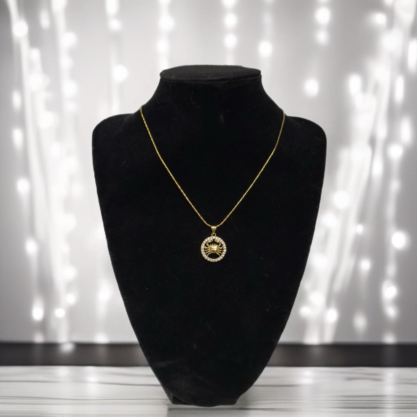 Gold zodiac pendant necklace