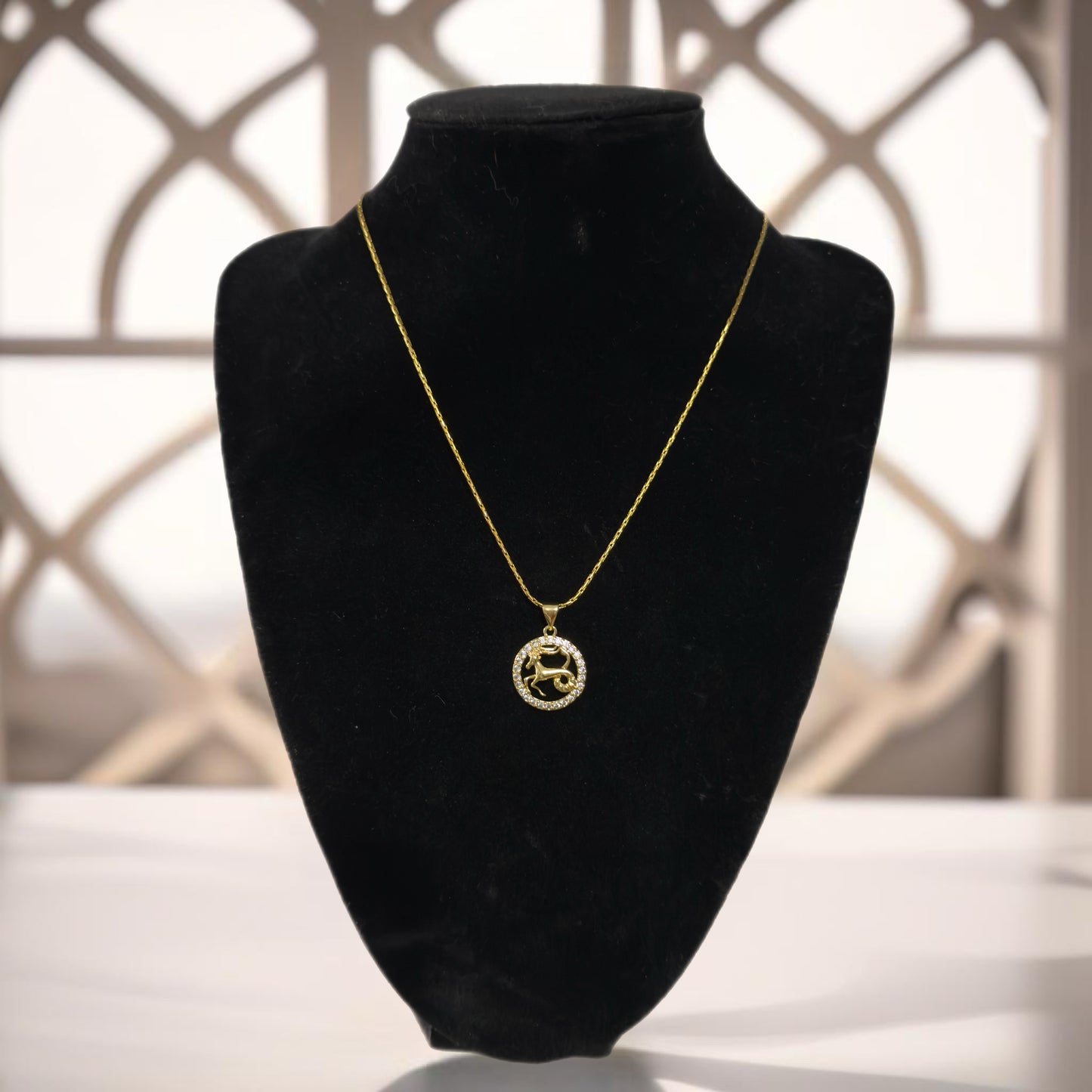 Gold zodiac pendant necklace