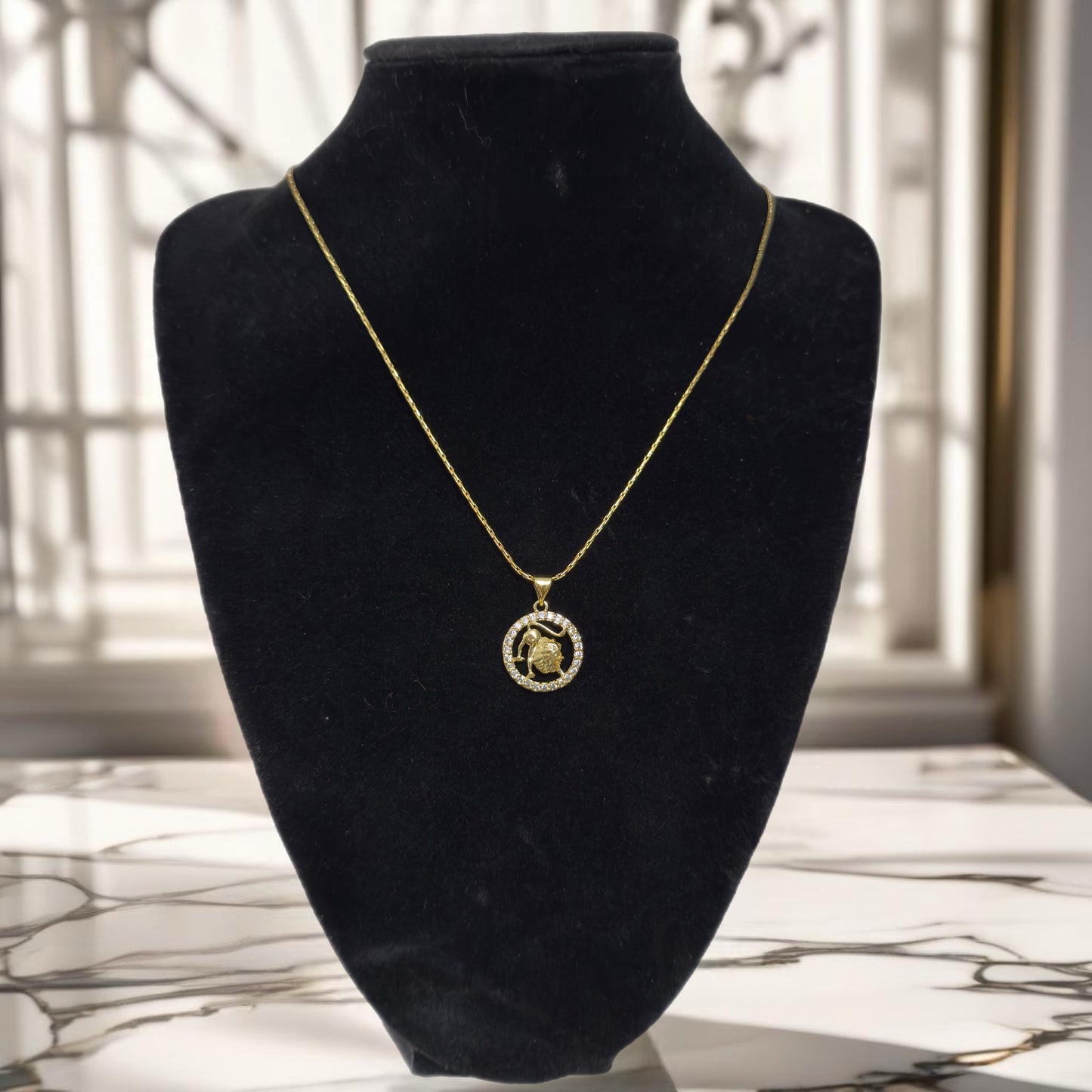 Gold zodiac pendant necklace