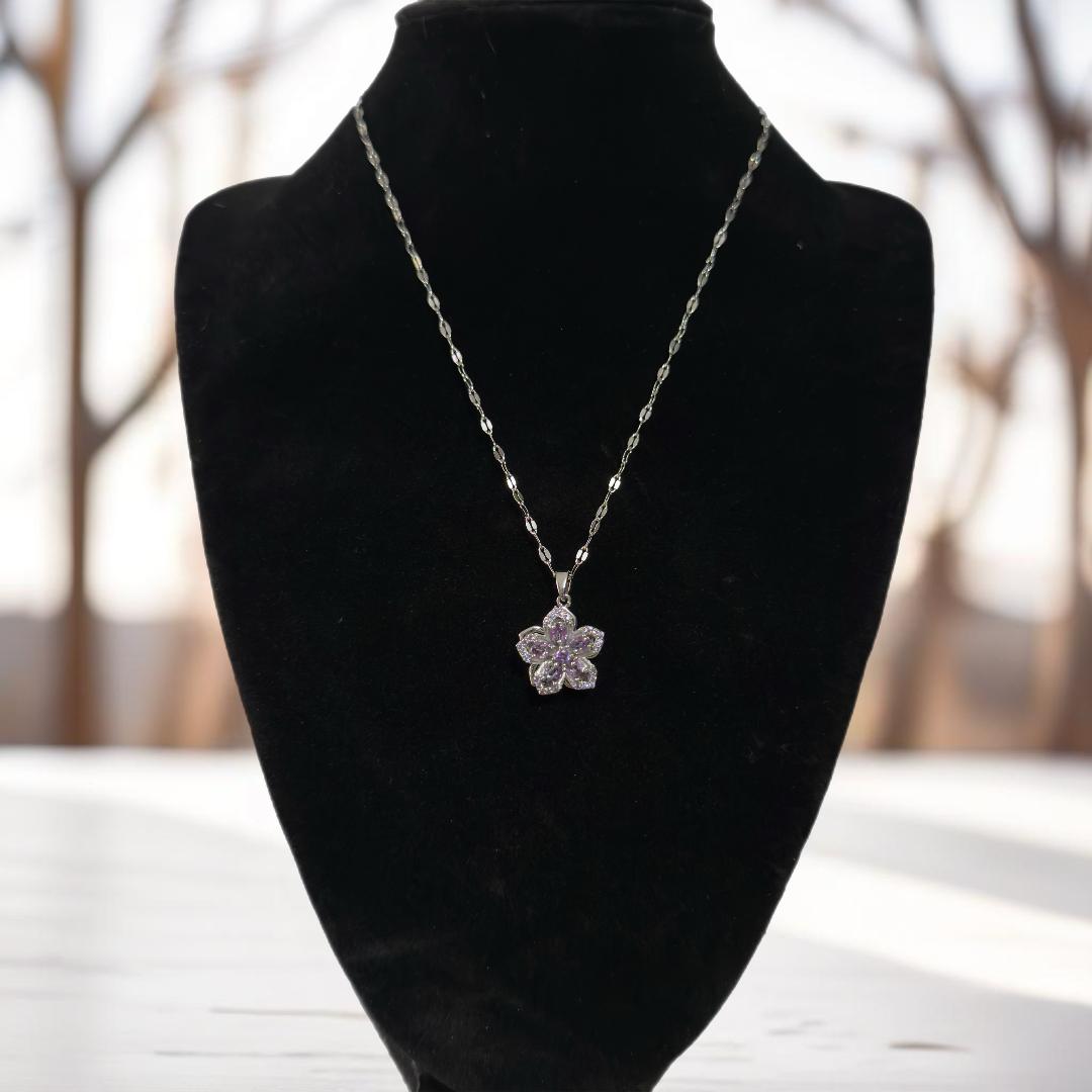 Silver flower pendant necklace.